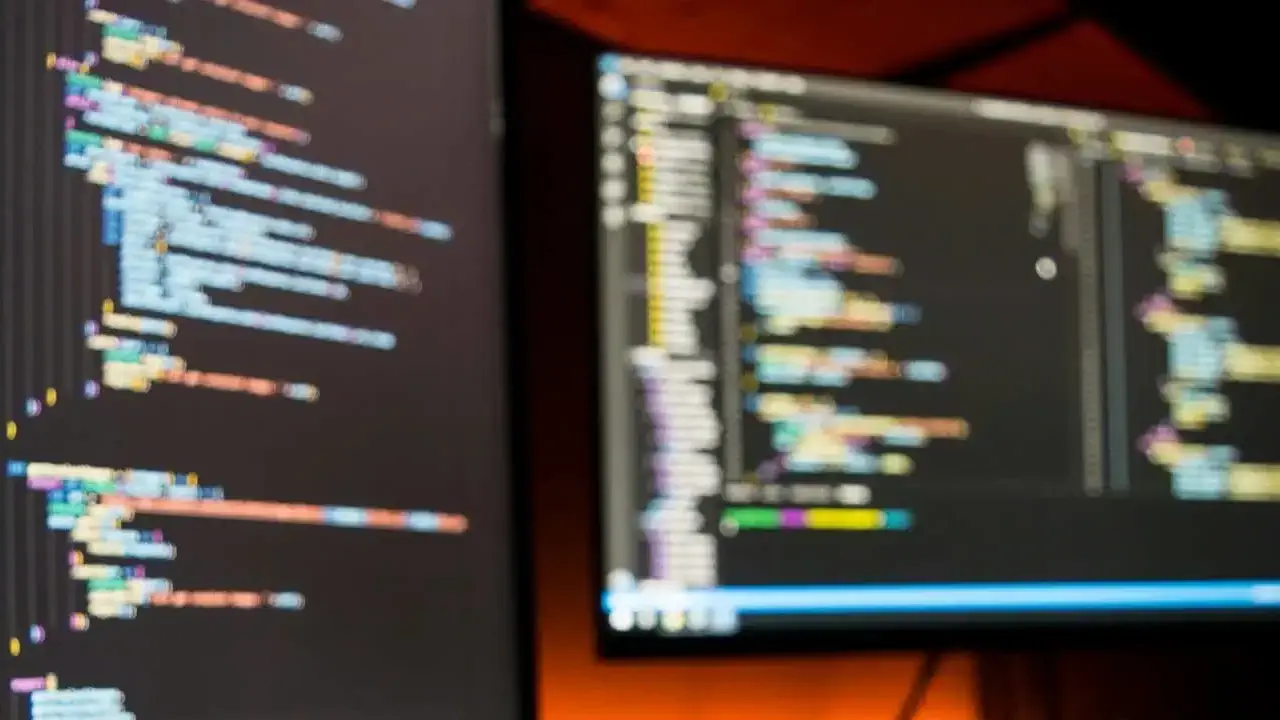 two screens with coding displayed